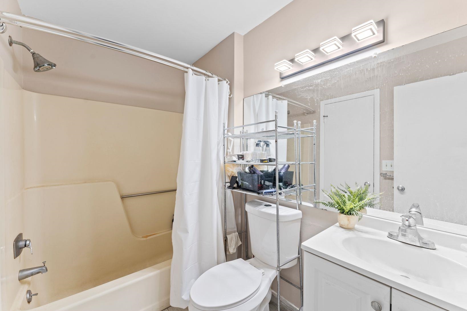 601 River Renaissance East Rutherford, NJ 07073 - Photo 11 of 26 a bathroom with a sink a toilet and shower