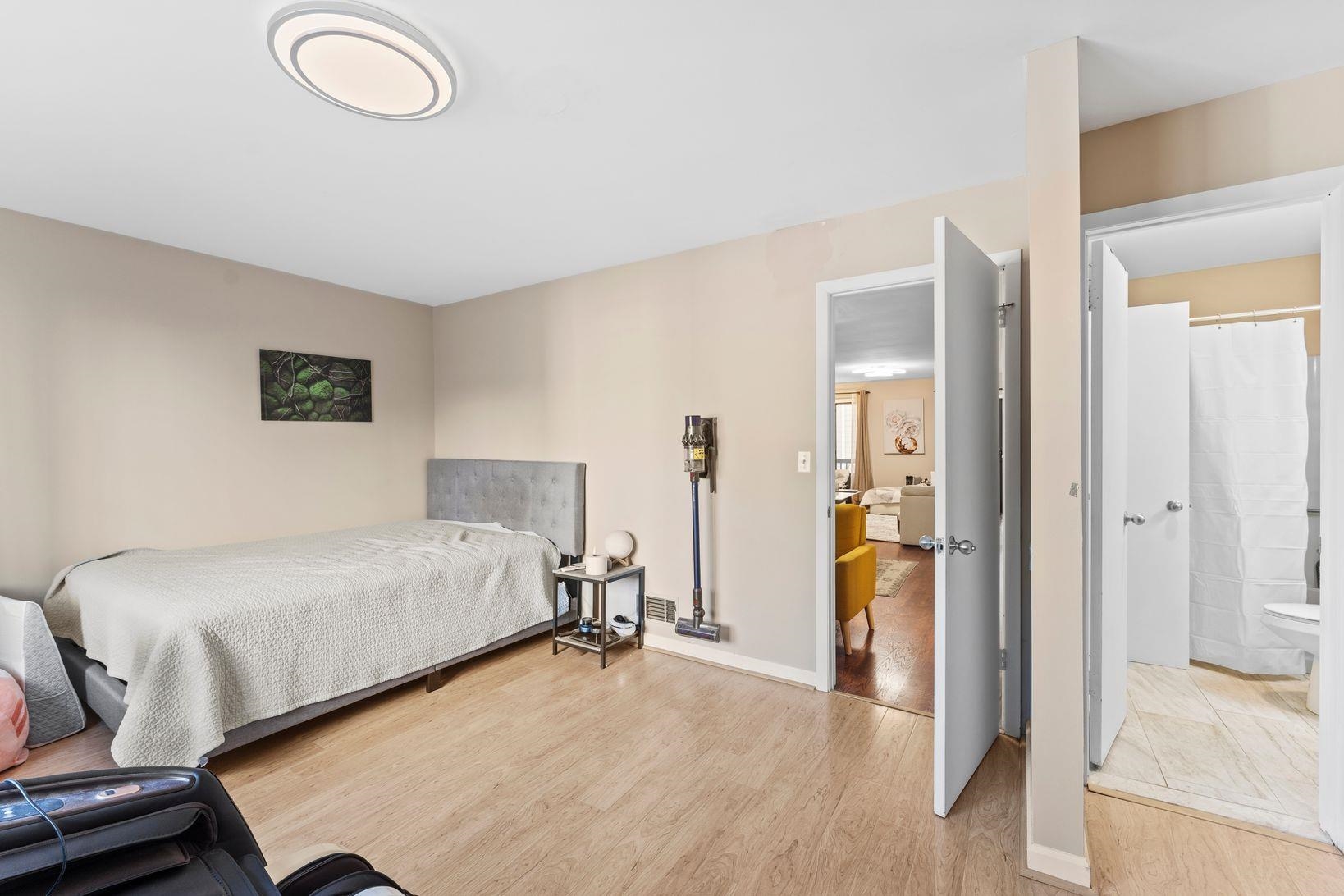 601 River Renaissance East Rutherford, NJ 07073 - Photo 15 of 26 a bedroom with a bed and a view of walk in closet
