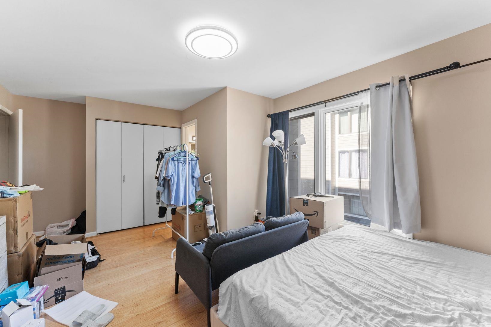 601 River Renaissance East Rutherford, NJ 07073 - Photo 17 of 26 a bedroom with bed and a window