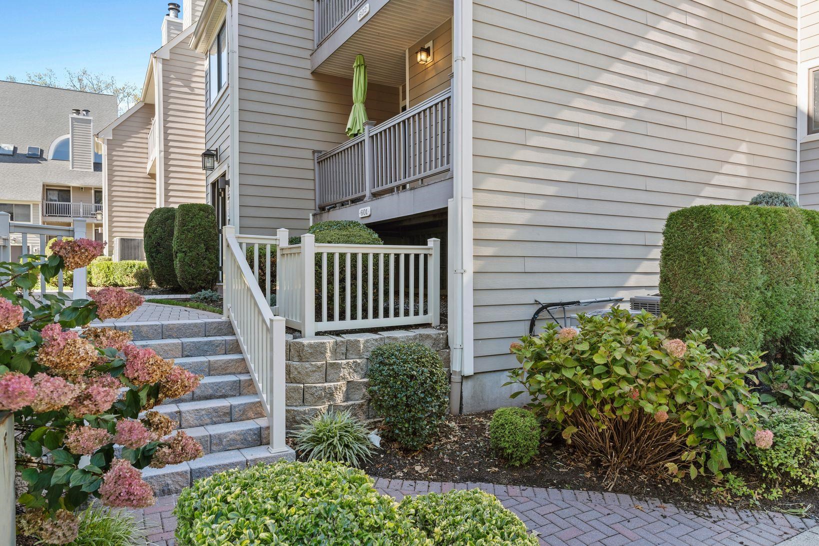 601 River Renaissance East Rutherford, NJ 07073 - Photo 2 of 26 a view of a house with a yard and plants