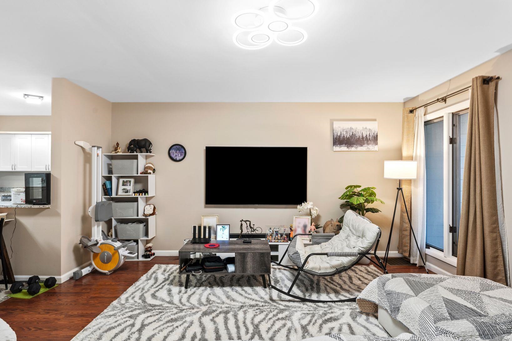 601 River Renaissance East Rutherford, NJ 07073 - Photo 4 of 26 a living room with furniture and a flat screen tv