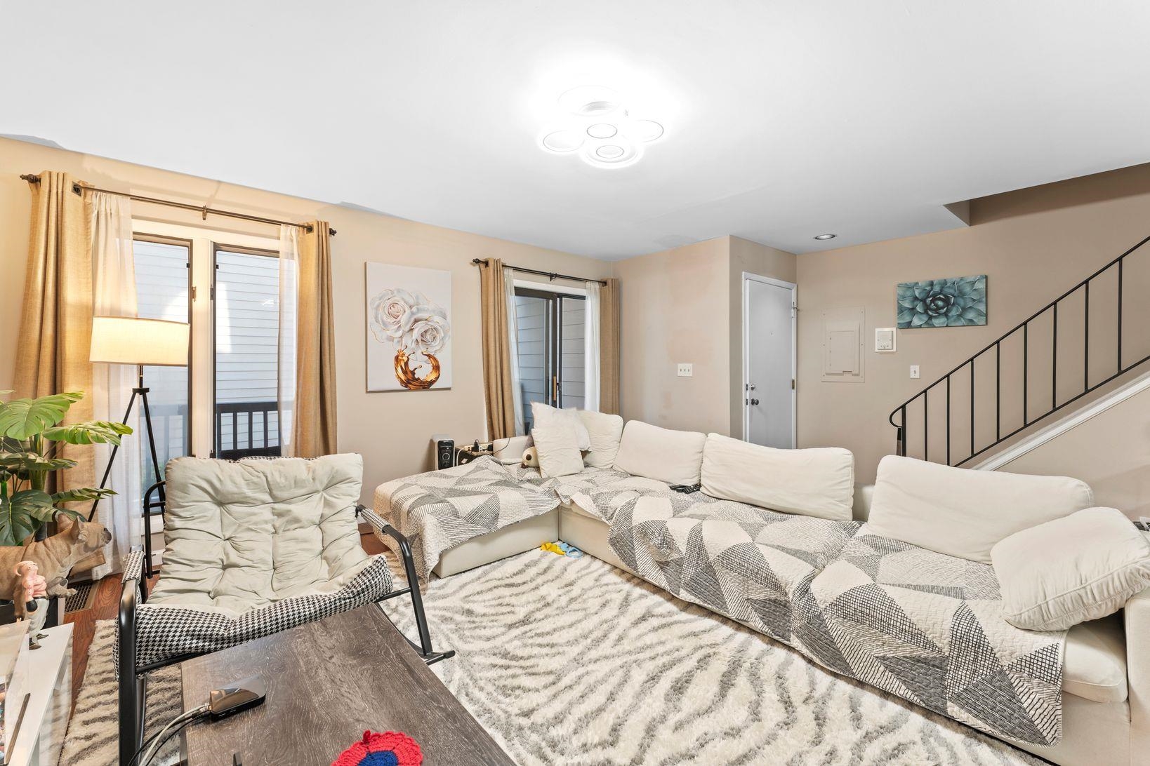 601 River Renaissance East Rutherford, NJ 07073 - Photo 6 of 26 a bedroom with a bed window and couch