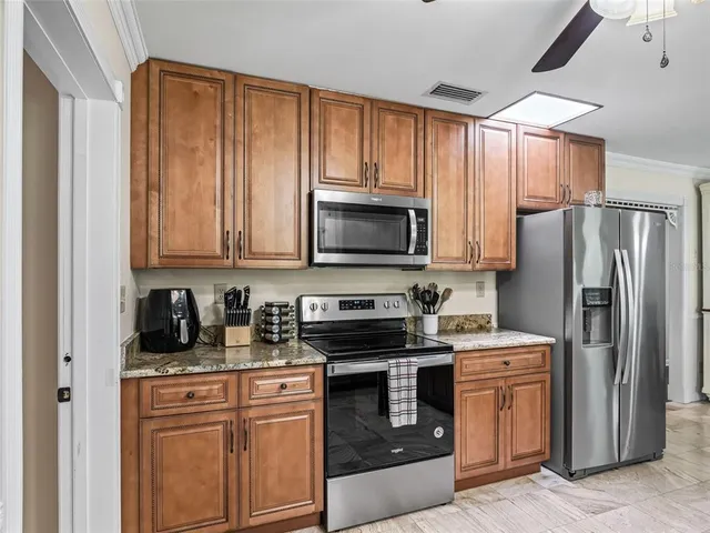 a living room with dining table and chairs