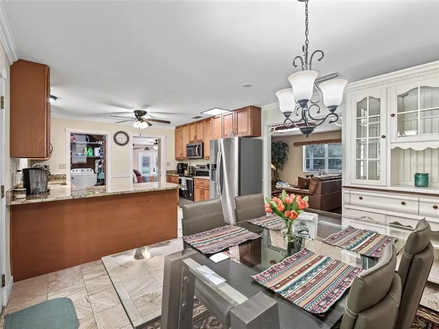 a view of a dining room with furniture window and outside view