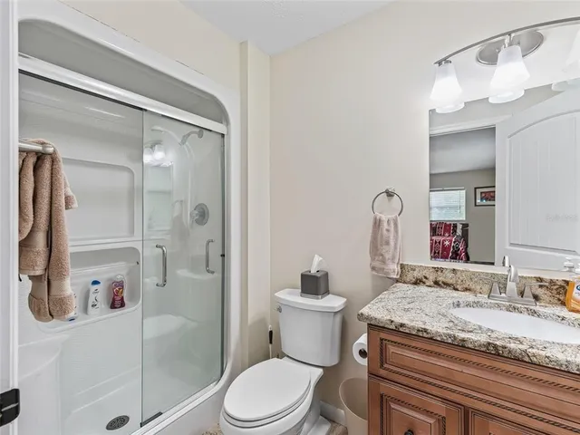 a living room with a bed furniture and a window