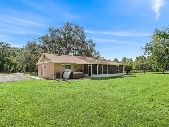a view of a house with a big yard