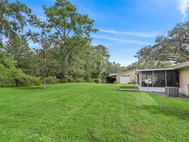 a view of a backyard of the house