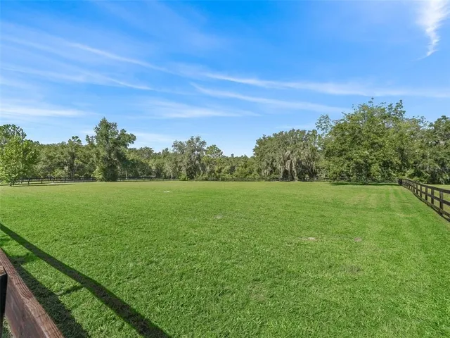 an aerial view of a house with a garden
