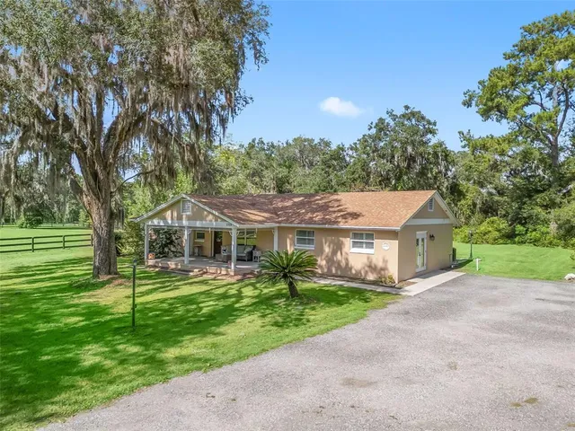a view of a big yard in front of a house