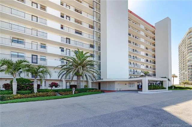 a front view of building with yard