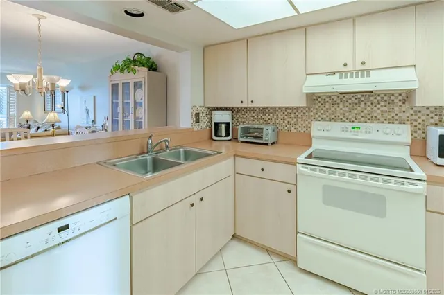 a bedroom with two beds and a window