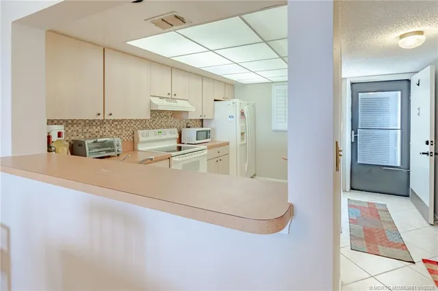 a room with furniture a washer and dryer