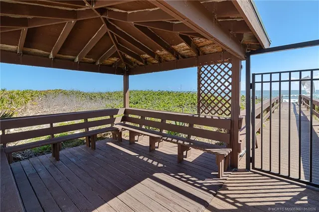 a view of a roof deck with wooden floor