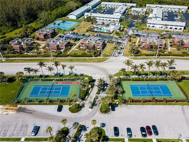 an aerial view of residential houses and outdoor space