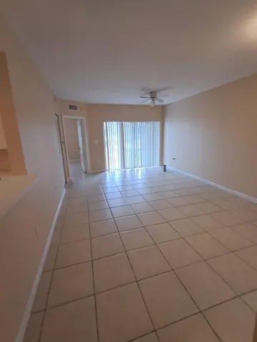 a view of a livingroom and window