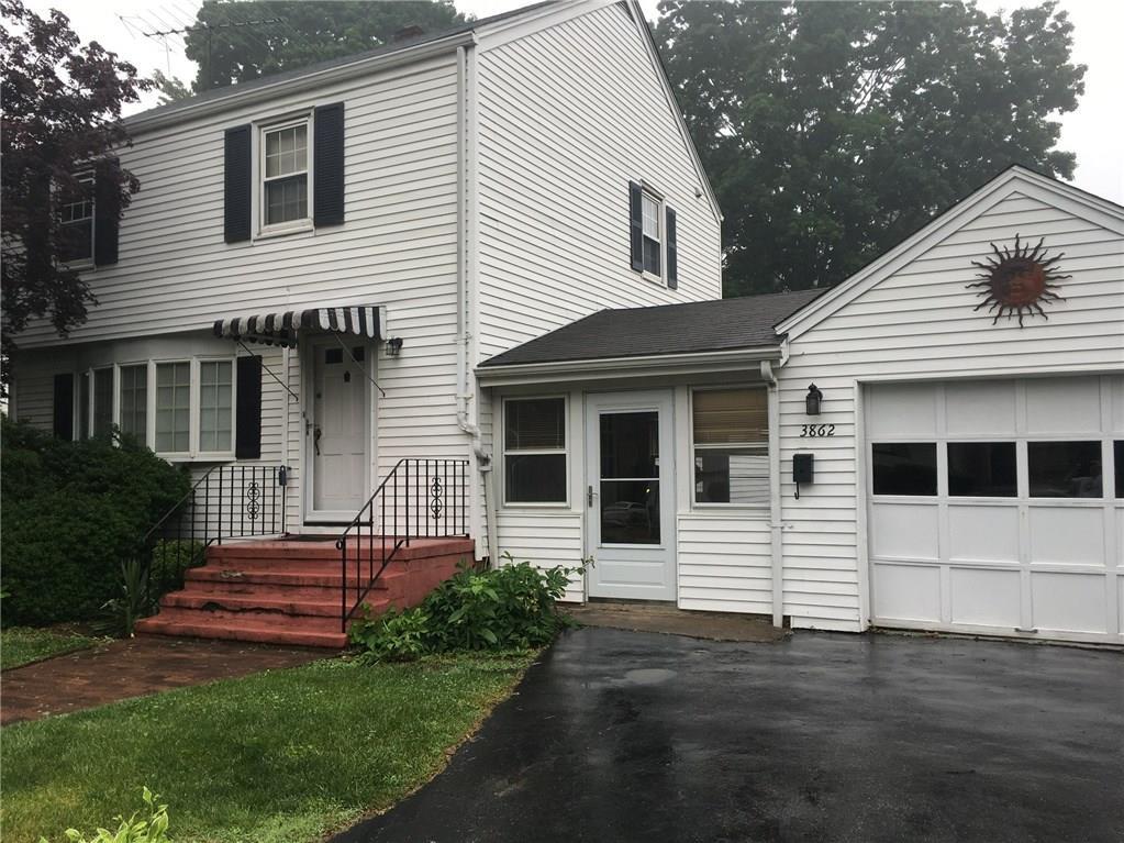3862 Old Town Road Bridgeport, CT 06606 - Photo 1 of 1 a front view of a house with a garden