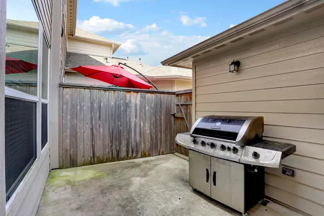 a view of a backyard with furniture