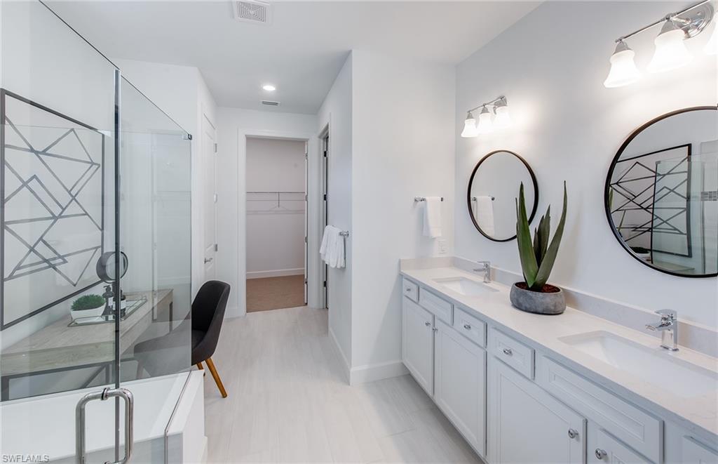 5637 Celebration Drive Immokalee, FL 34142 - Photo 13 of 35 a view of bathroom with dual sinks