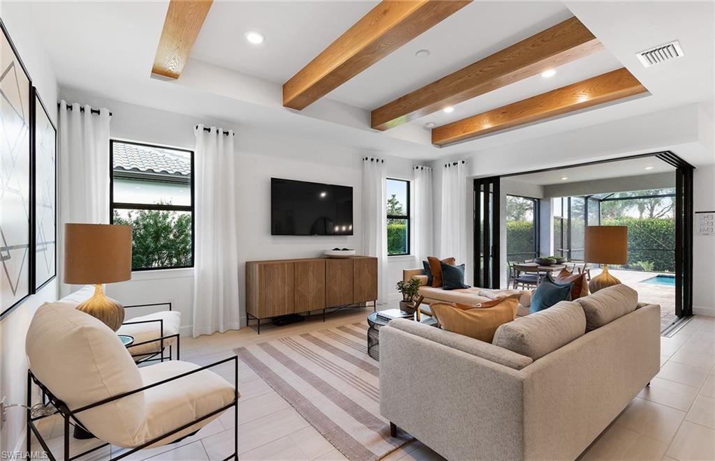 5637 Celebration Drive Immokalee, FL 34142 - Photo 6 of 35 a living room with furniture and a flat screen tv