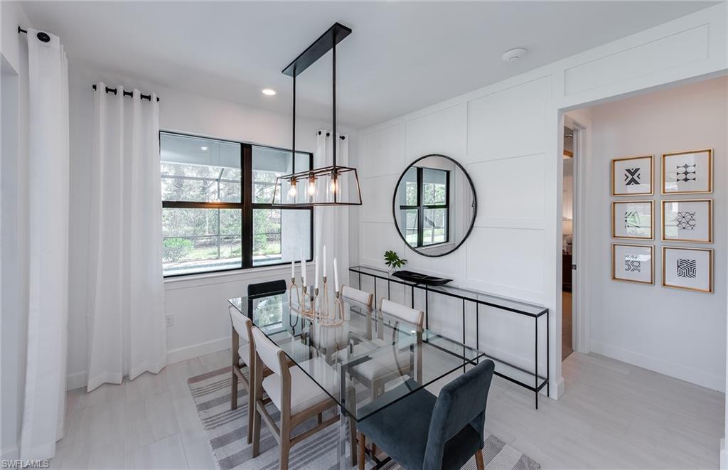 5637 Celebration Drive Immokalee, FL 34142 - Photo 7 of 35 a view of a dining room with furniture window and wooden floor