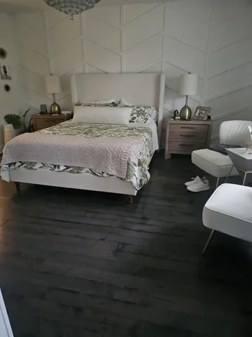 a kitchen with a stove and a white wooden cabinets