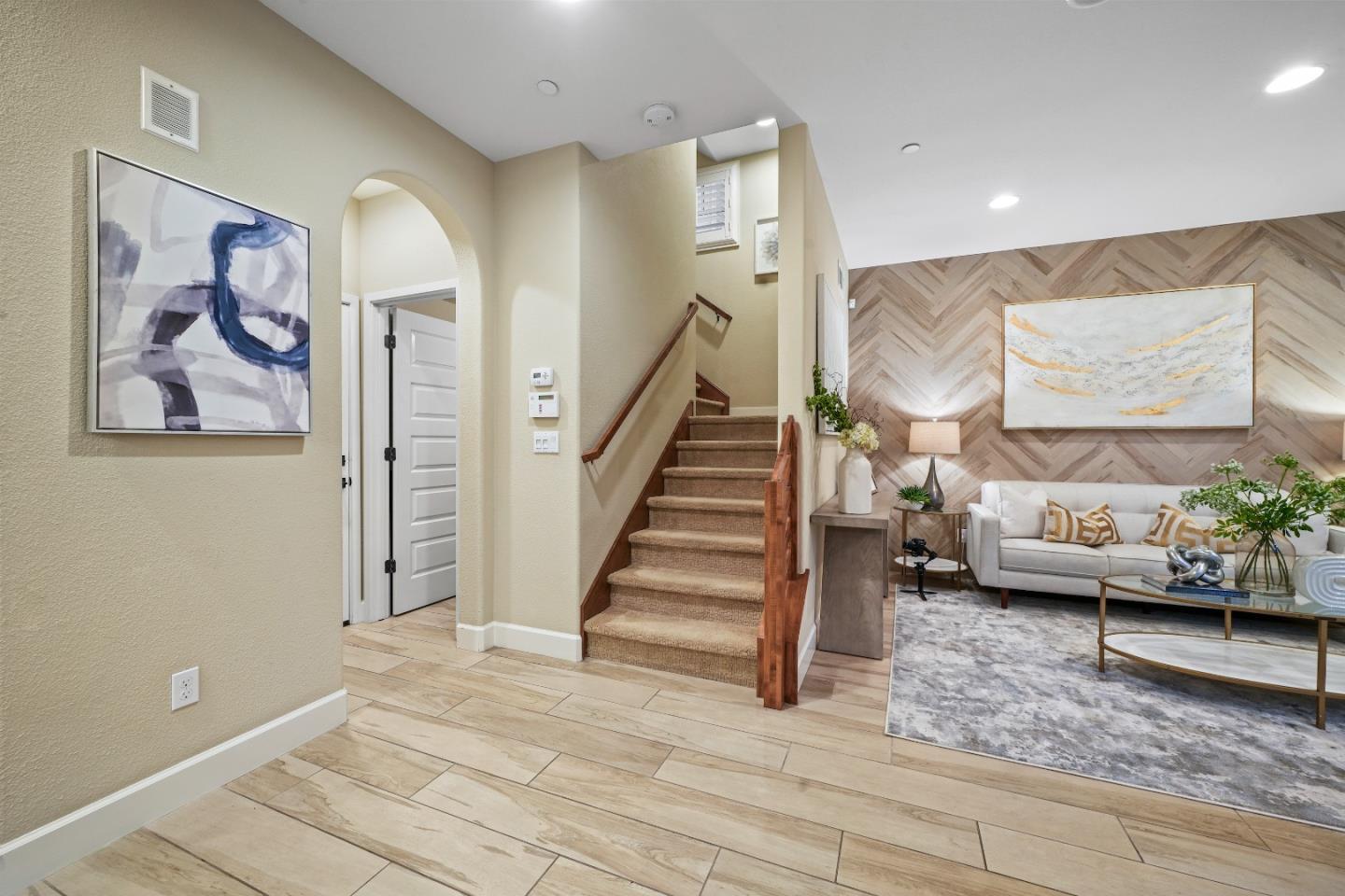 136 Avellino Way Mountain View, CA 94043 - Photo 11 of 40 a living room with furniture and stairs