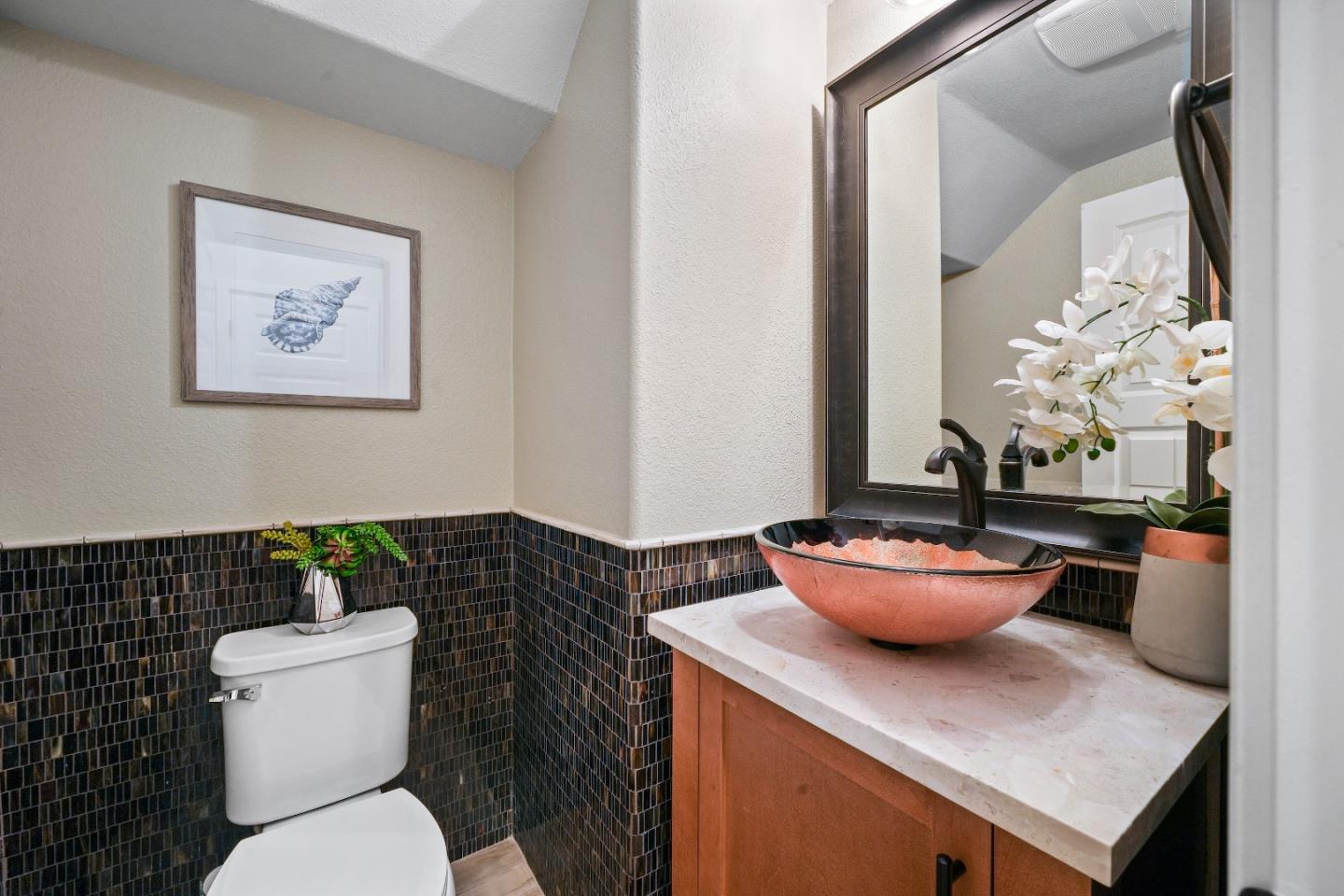 136 Avellino Way Mountain View, CA 94043 - Photo 12 of 40 a bathroom with a toilet a sink and a mirror