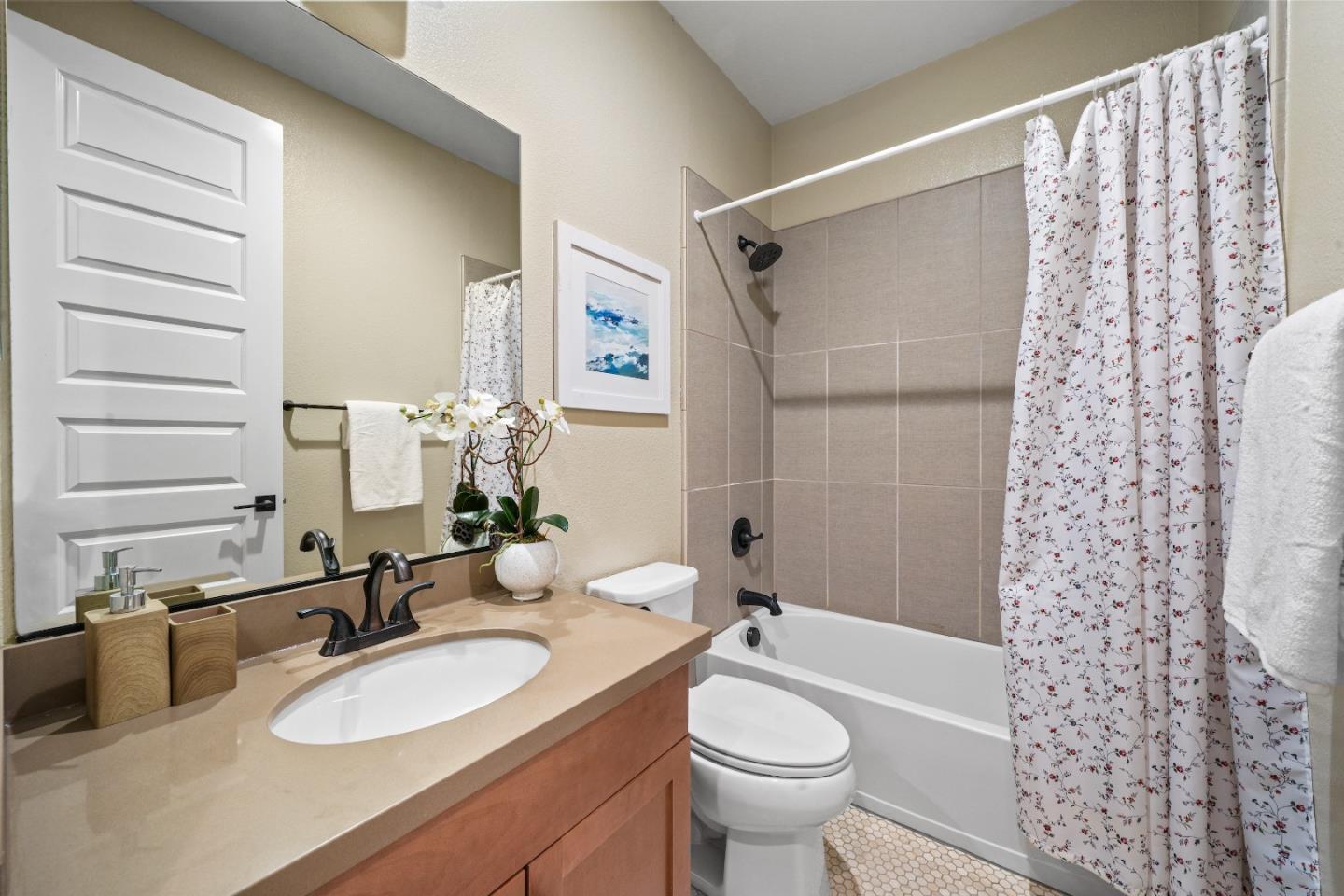 136 Avellino Way Mountain View, CA 94043 - Photo 14 of 40 a bathroom with a sink a toilet and shower