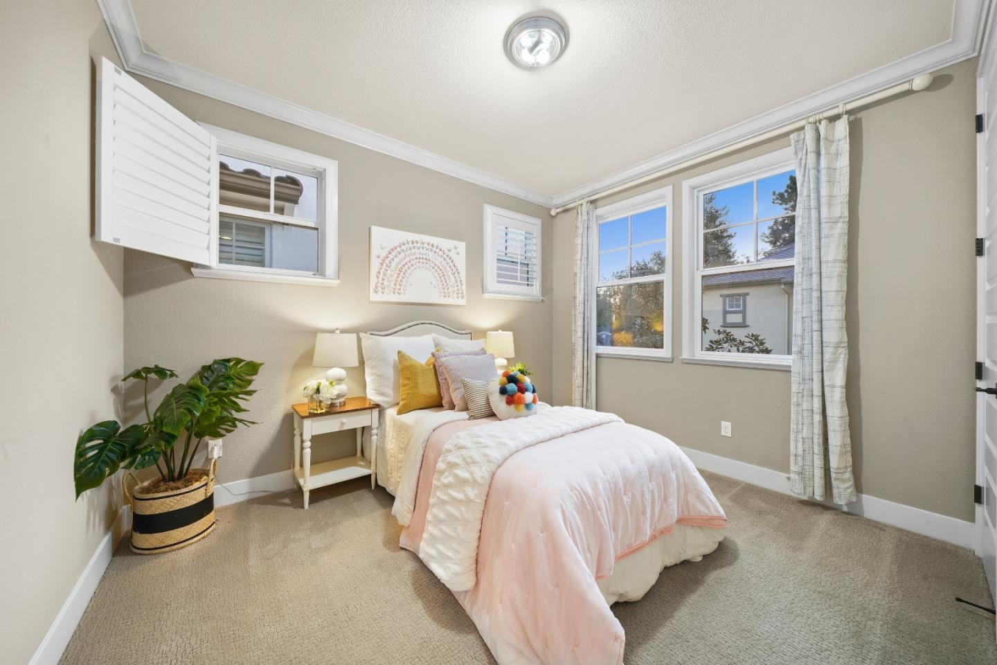 136 Avellino Way Mountain View, CA 94043 - Photo 17 of 40 a bedroom with a bed and potted plant