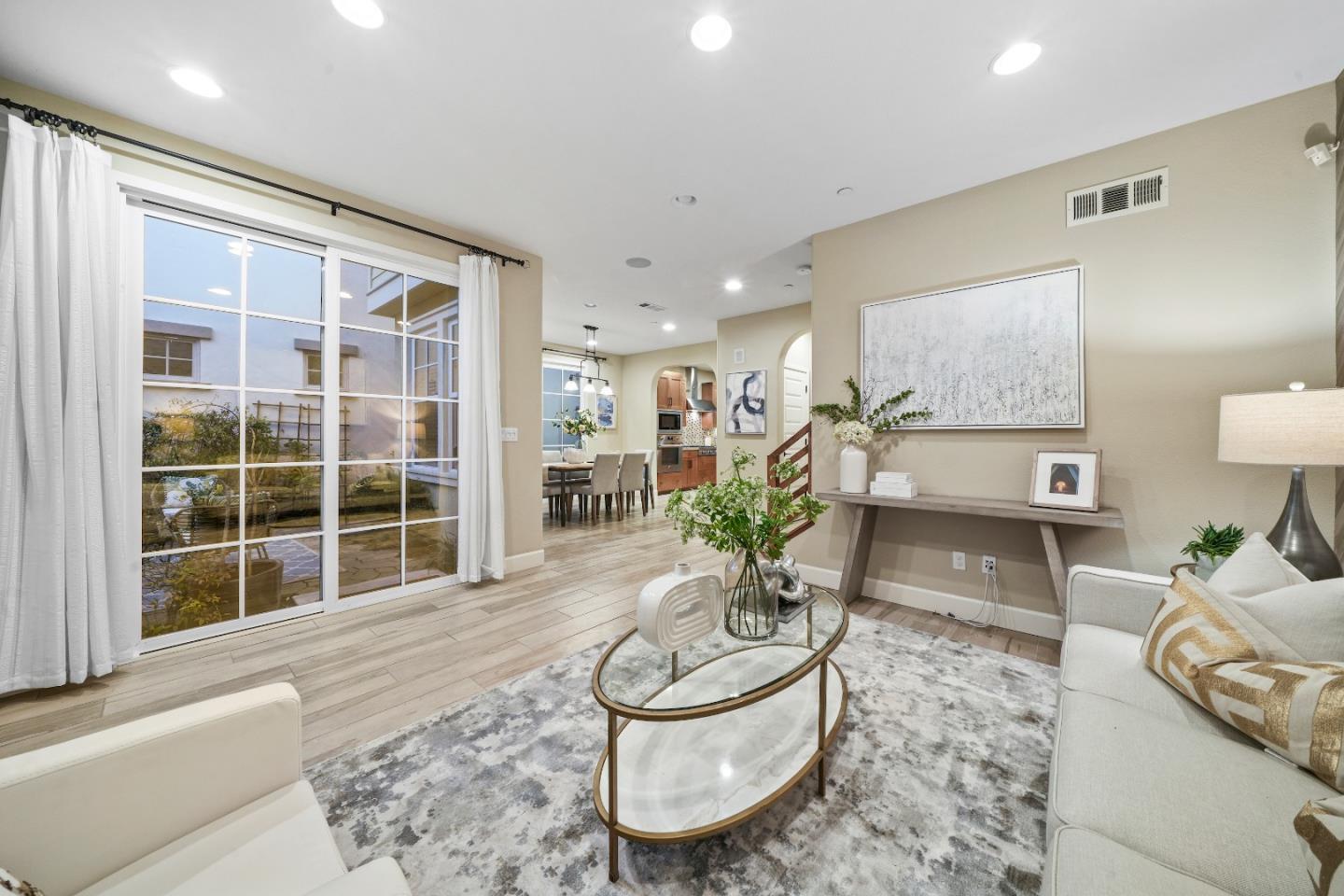 136 Avellino Way Mountain View, CA 94043 - Photo 2 of 40 a living room with furniture and a potted plant
