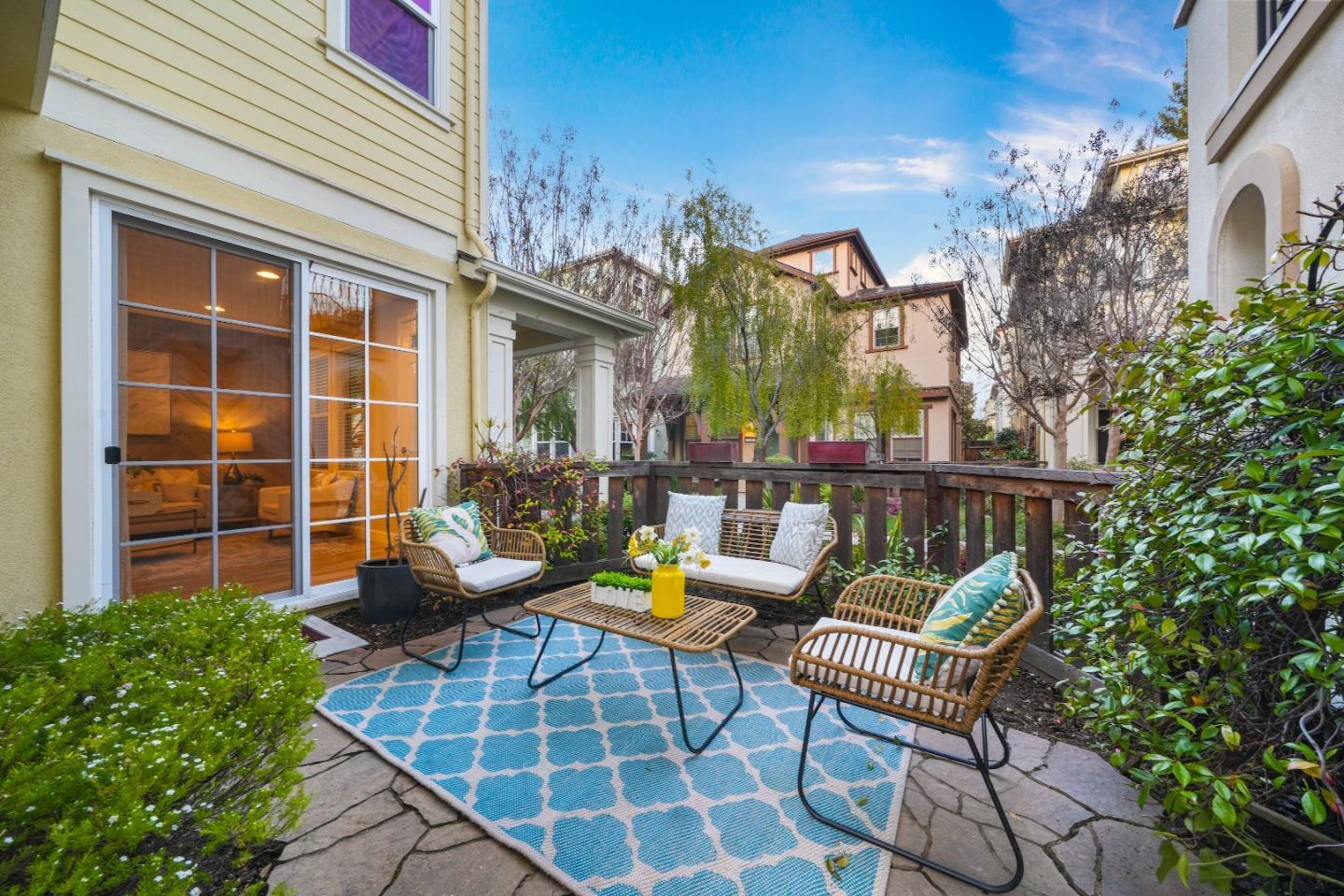 136 Avellino Way Mountain View, CA 94043 - Photo 28 of 40 a view of a patio with couches table and chairs and potted plants