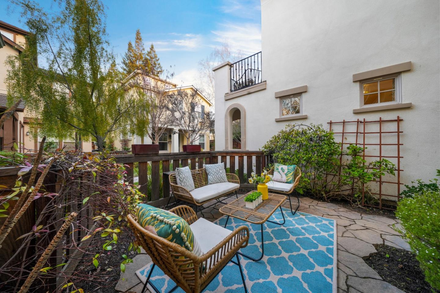 136 Avellino Way Mountain View, CA 94043 - Photo 29 of 40 a view of a patio with couches table and chairs and potted plants