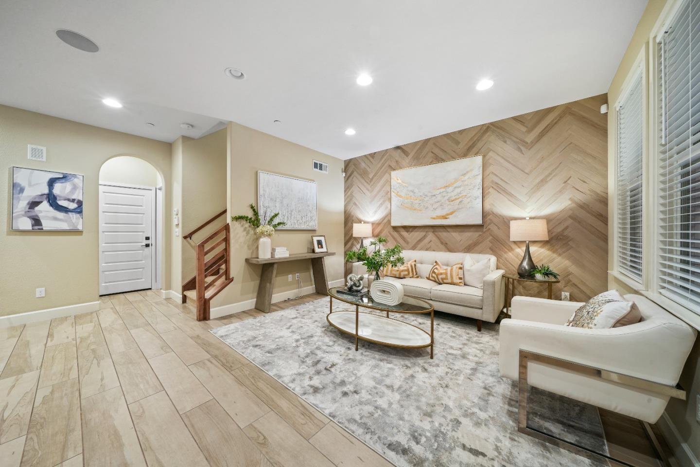136 Avellino Way Mountain View, CA 94043 - Photo 3 of 40 a living room with furniture and a wooden floor