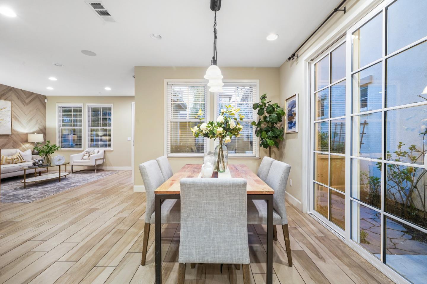 136 Avellino Way Mountain View, CA 94043 - Photo 7 of 40 a dining room with furniture window and wooden floor
