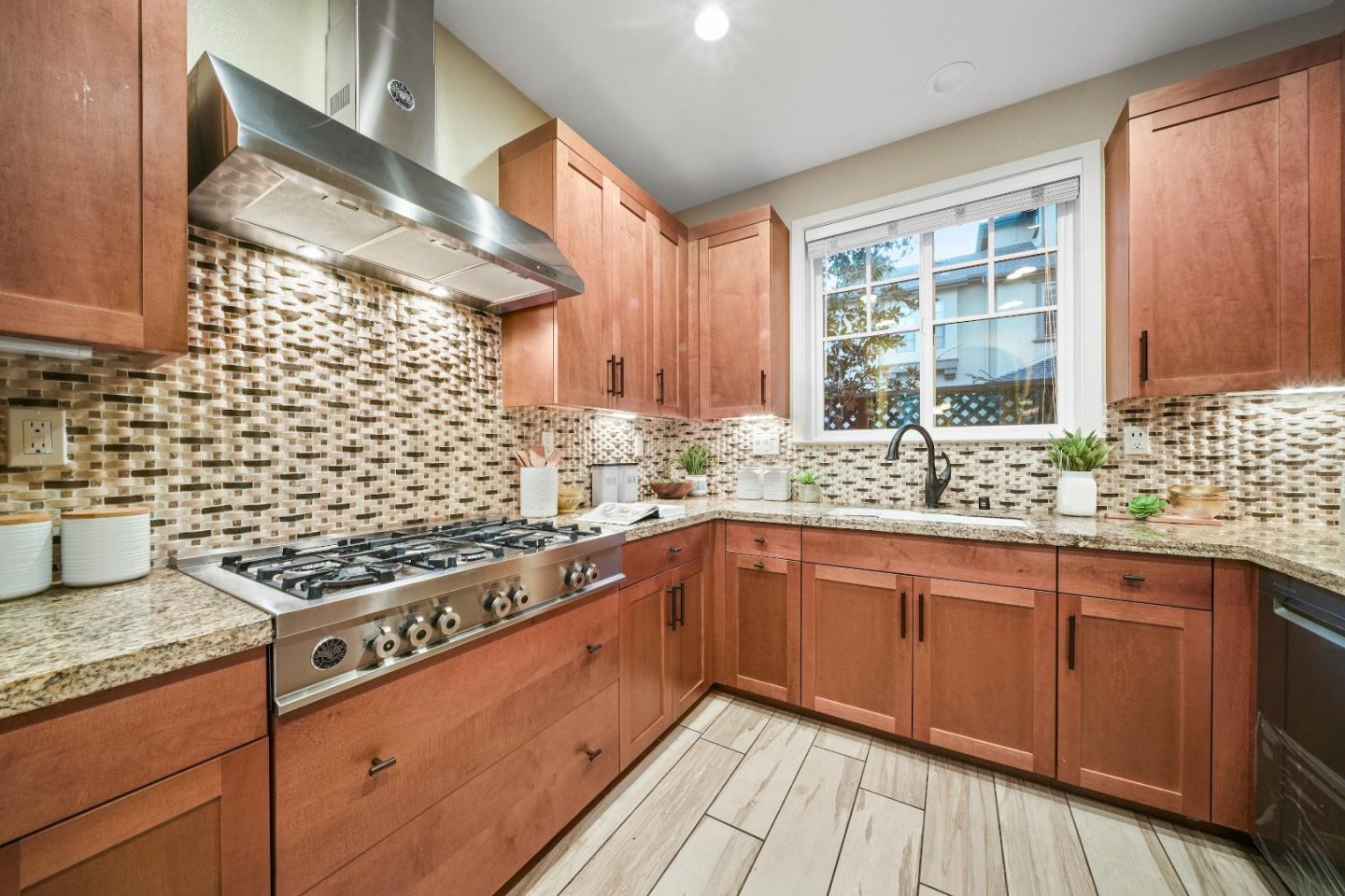 136 Avellino Way Mountain View, CA 94043 - Photo 9 of 40 a kitchen with stainless steel appliances granite countertop a sink stove and cabinets