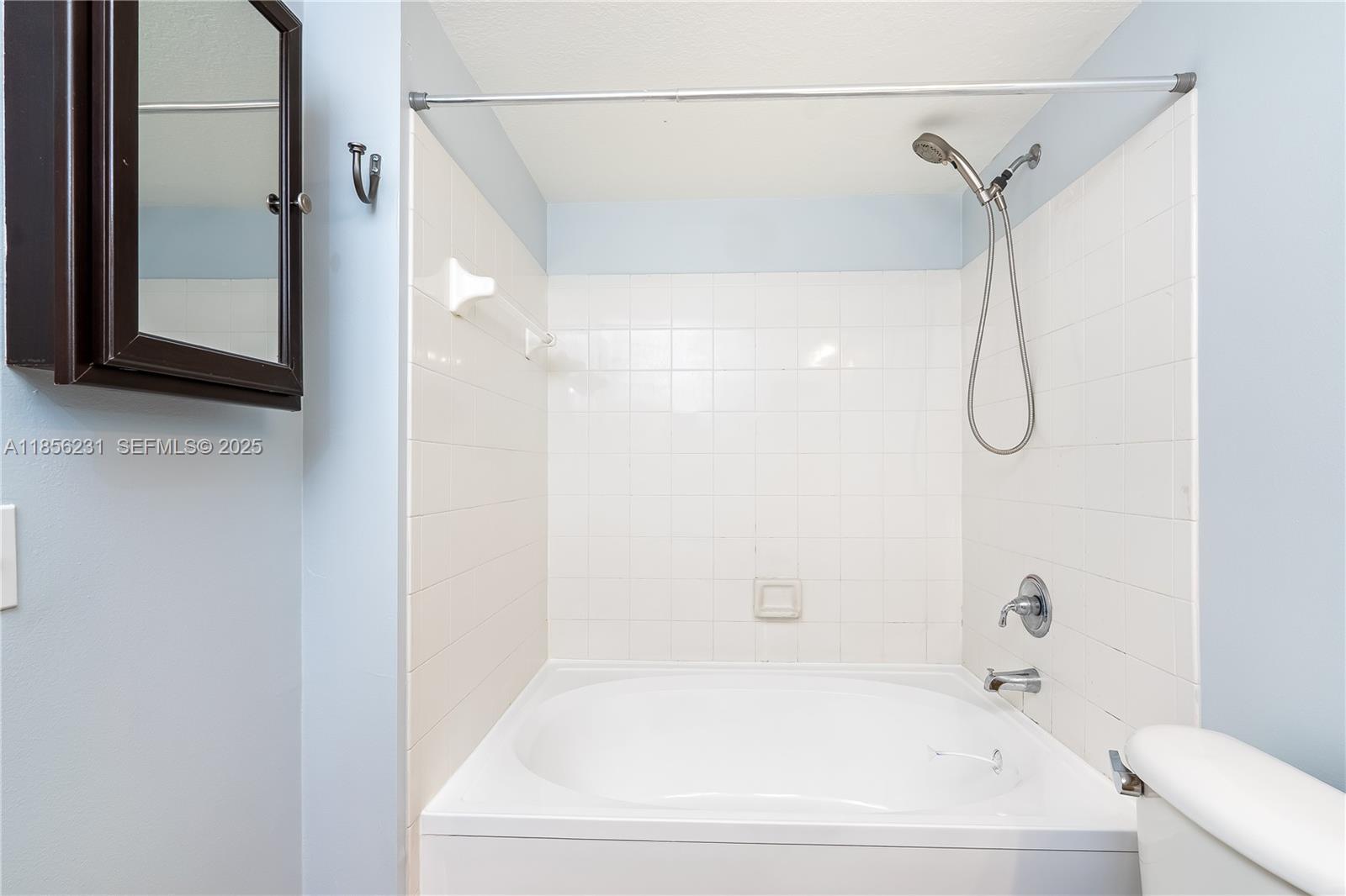 1308 Villa Circle, Unit 1308 Boynton Beach, FL 33435 - Photo 16 of 35 a bathroom with a bath tub with a shower