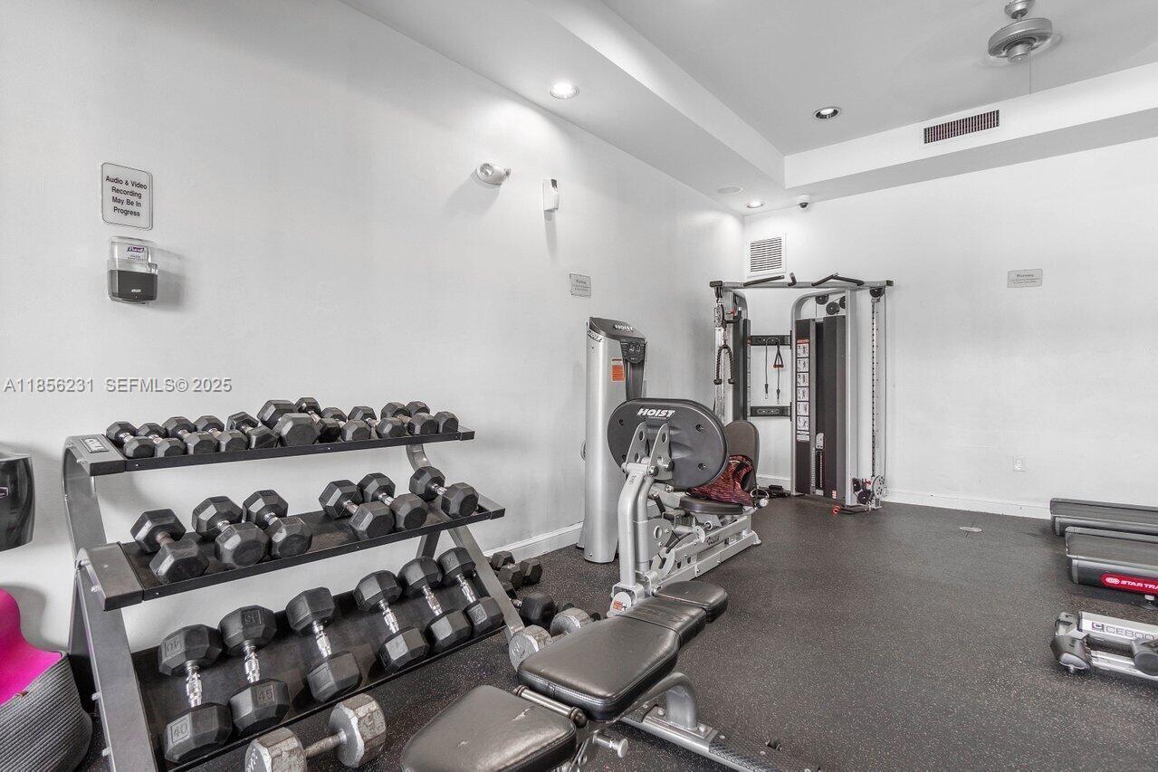 1308 Villa Circle, Unit 1308 Boynton Beach, FL 33435 - Photo 27 of 35 a view of a room with gym equipment