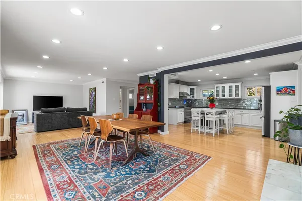 a living room with furniture a rug and a table