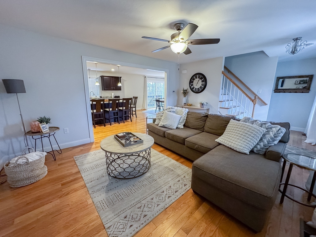 23 Ralph Street Chicopee, MA 01020 - Photo 16 of 42 a living room with furniture and a chandelier