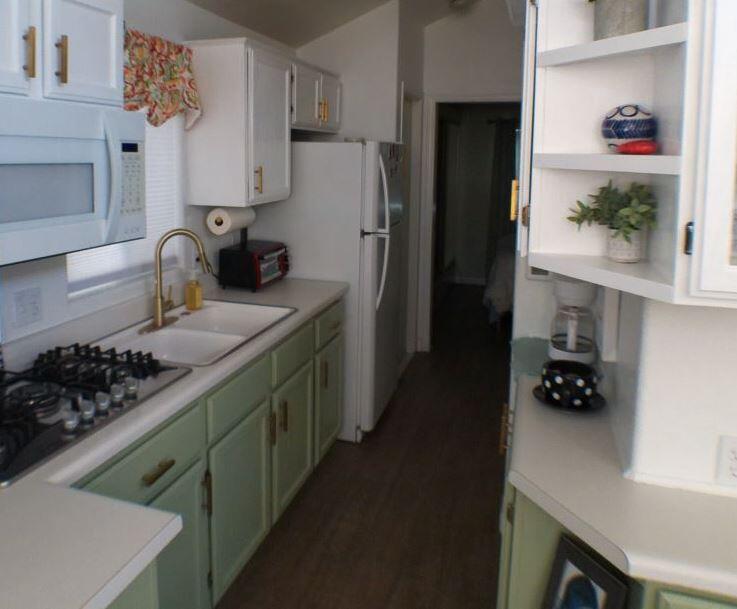84136 Ave 44, Unit 602 Indio, CA 92203 - Photo 11 of 43 a kitchen with stainless steel appliances granite countertop a refrigerator and a stove