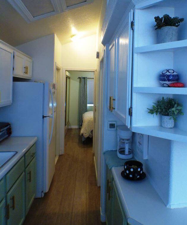 84136 Ave 44, Unit 602 Indio, CA 92203 - Photo 19 of 43 a kitchen with a refrigerator and a stove