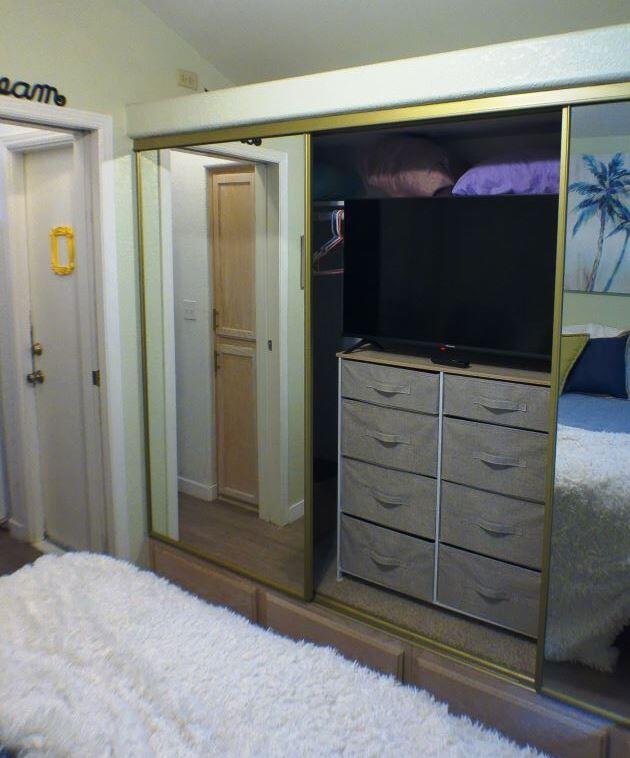 84136 Ave 44, Unit 602 Indio, CA 92203 - Photo 30 of 43 a view of room with wooden floor and flat screen tv