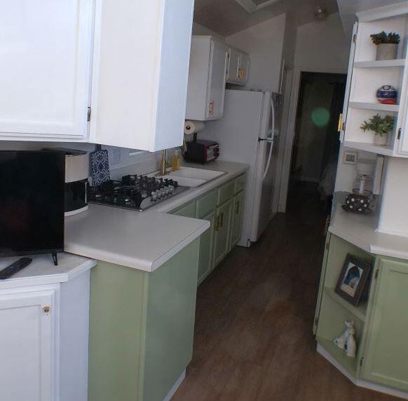 84136 Ave 44, Unit 602 Indio, CA 92203 - Photo 10 of 43 a kitchen with a sink a stove and refrigerator