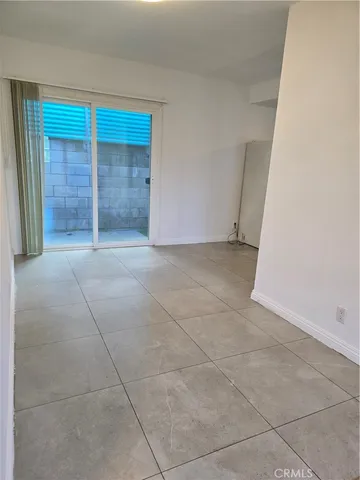 an empty room with a empty space and windows