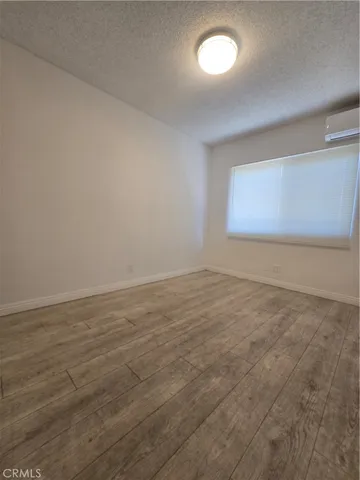 wooden floor and window in an empty room