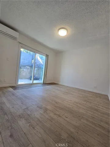 a bathroom with a sink toilet a mirror and shower