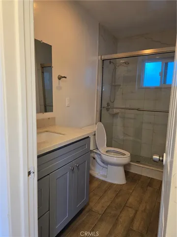 a kitchen with a stove sink and cabinets