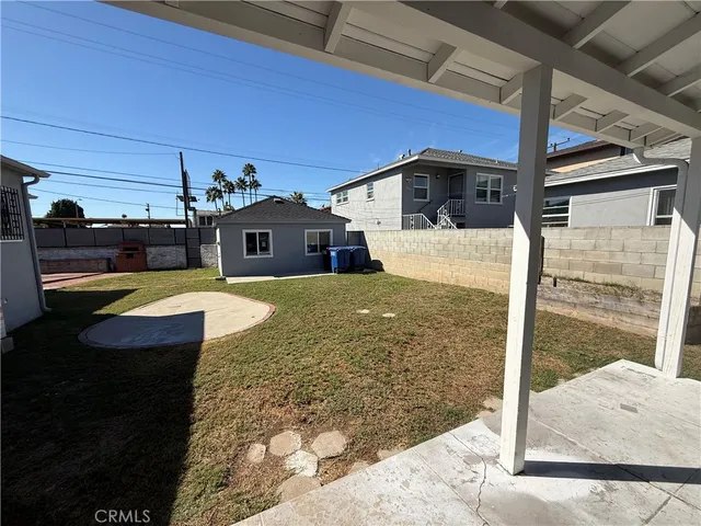 a view of a balcony with a table and chairs