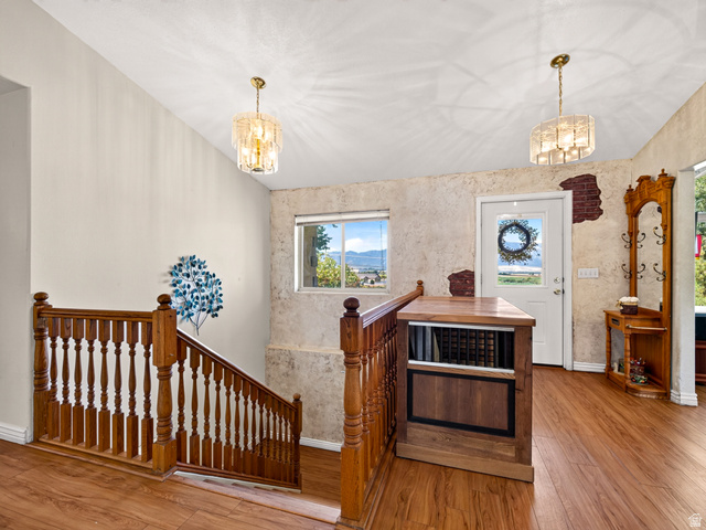 4380 Main Street Logan, UT 84321 - Photo 12 of 74 Wood-finish flooring throughout, solid wood staircase with balusters, and front entry