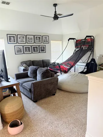 a bedroom with bed and a couch